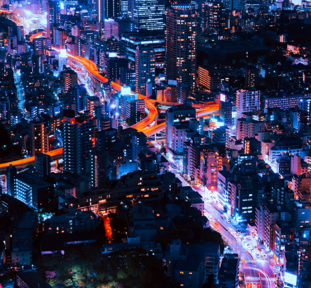 Ariel night view of a high-tech city.