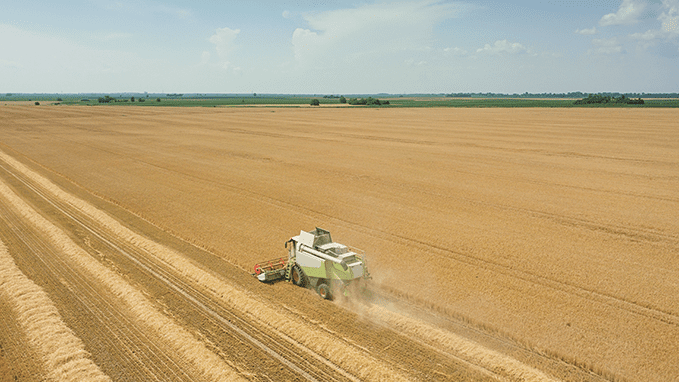 An autonomous tractor at work illustrates the use of artificial intelligence in agriculture.