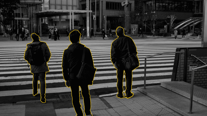 An image of men standing near a zebra crossing is highlighted.