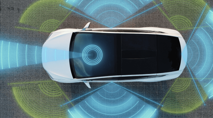 A self-driving autopilot car with sensors scanning the road ahead for vehicles, danger and speed limits.