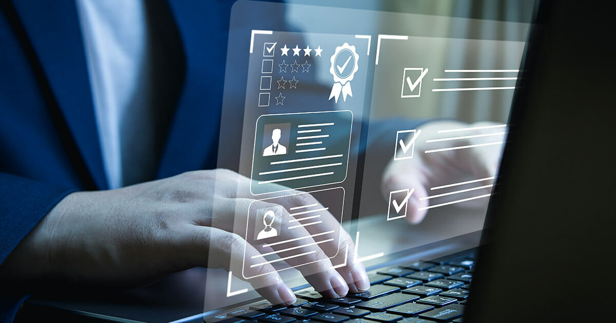 A close-up image of an AI expert's hands using a laptop with feedback icons illustrates the Reinforcement Learning from Human Feedback.